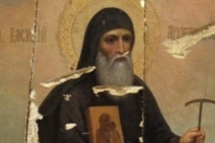 Икона святителя Василия Рязанского, изрубленная топором и обожженная.